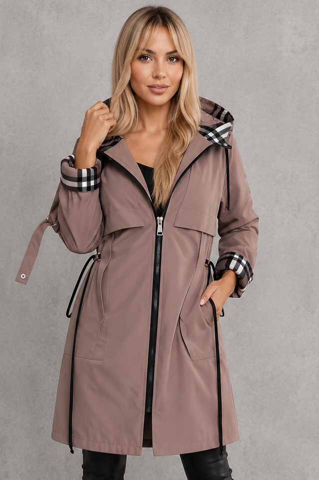 Women’s hooded waterproof rain jacket with a lightweight windproof design, full front zipper, soft lining, and flattering tailored silhouette.