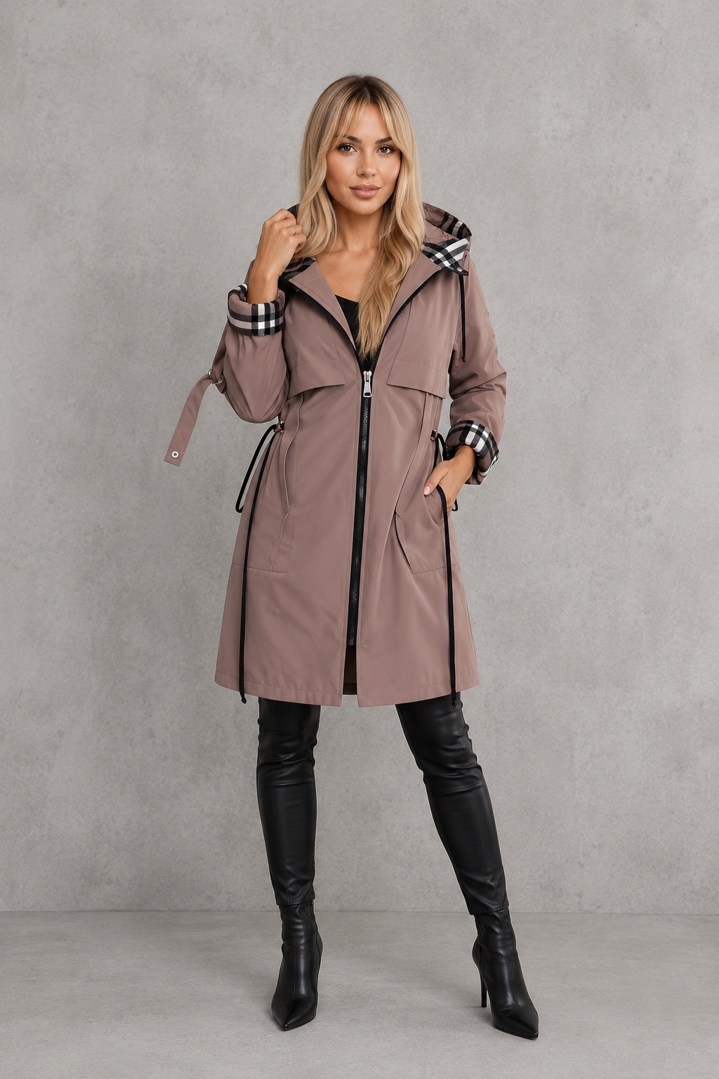 Women’s hooded waterproof rain jacket with a lightweight windproof design, full front zipper, soft lining, and flattering tailored silhouette.