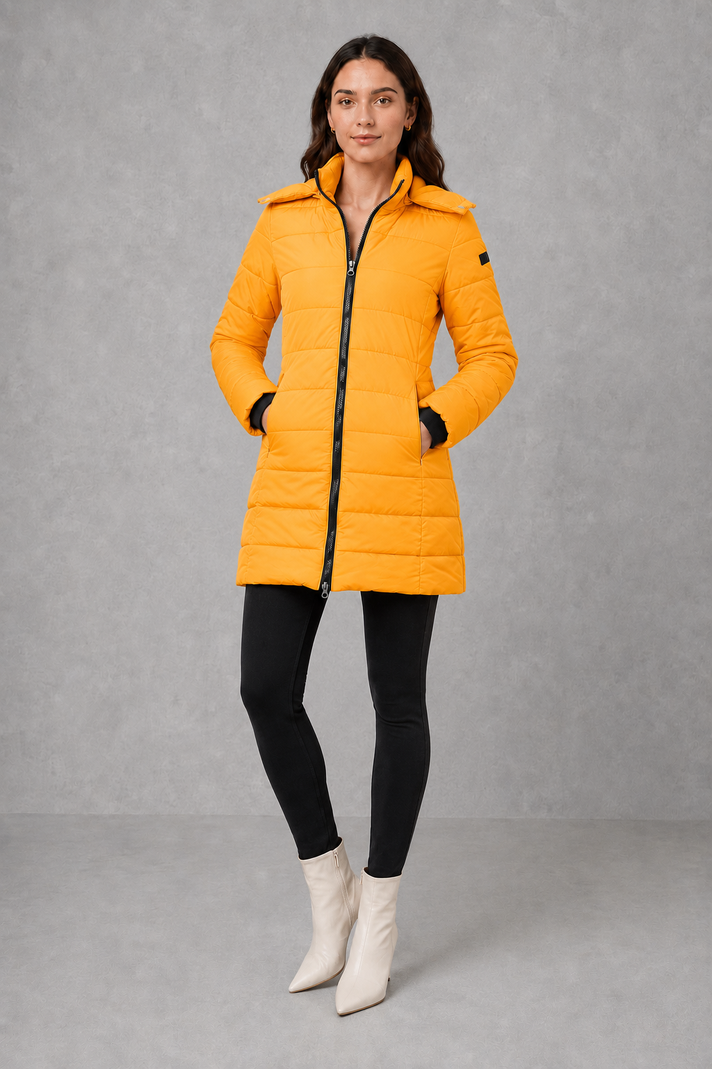 Women’s insulated hooded puffer coat with lightweight padding, protective hood, full-length front zipper, and a streamlined silhouette for cold-weather wear.