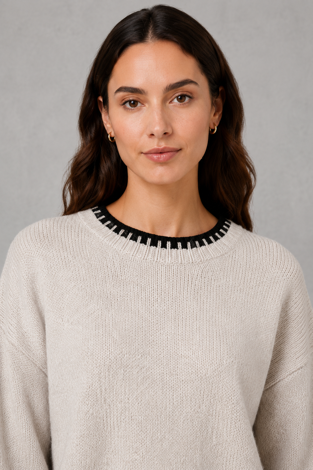 Women’s two-piece knit set featuring a relaxed crew-neck sweater with contrast trim and matching wide-leg knit pants.