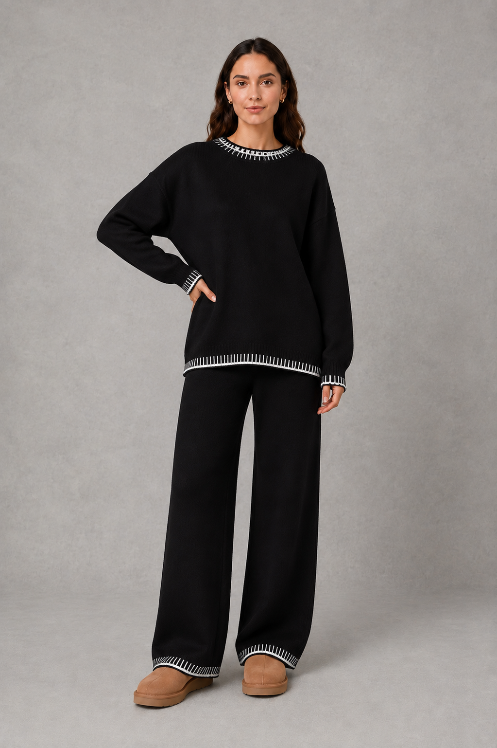 Women’s two-piece knit set featuring a relaxed crew-neck sweater with contrast trim and matching wide-leg knit pants.