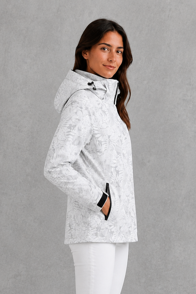 Women’s leaf print hooded rain jacket with a botanical pattern, adjustable drawstring waist and lightweight waterproof, windproof construction.