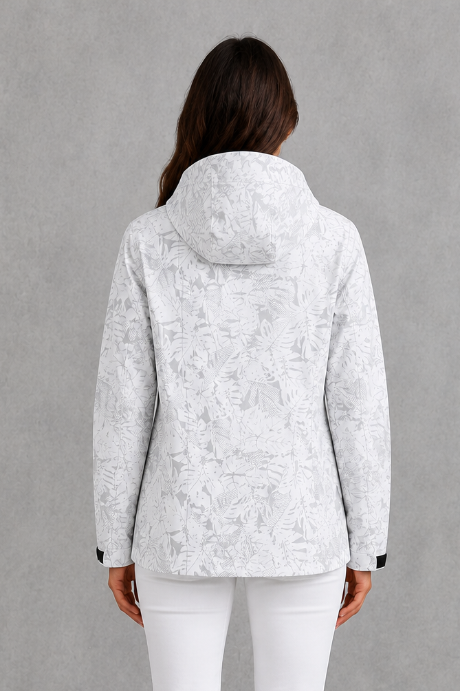 Women’s leaf print hooded rain jacket with a botanical pattern, adjustable drawstring waist and lightweight waterproof, windproof construction.