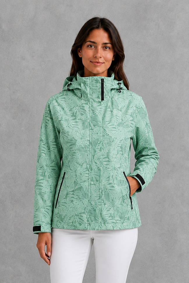 Women’s leaf print hooded rain jacket with a botanical pattern, adjustable drawstring waist and lightweight waterproof, windproof construction.