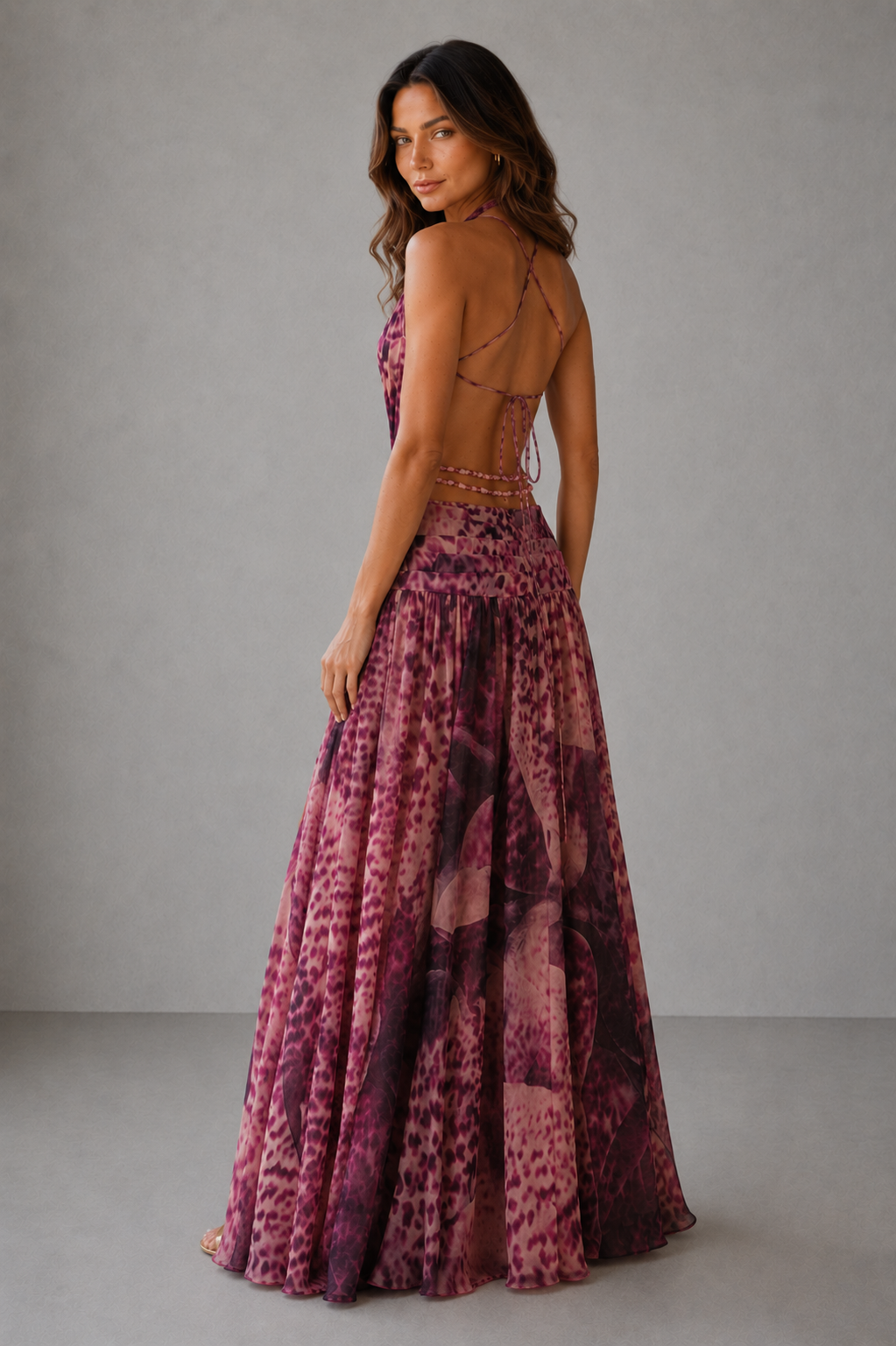 Women’s leopard print chiffon maxi dress with a plunge neckline, open back, beaded waist chains and thigh-high split for formal evening wear.