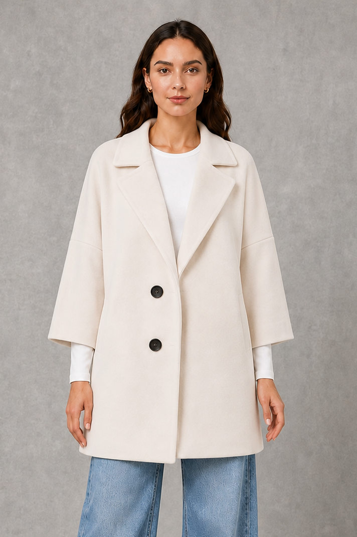 Women’s lightweight longline coat with a soft-touch finish and elegant streamlined silhouette for polished transitional layering.