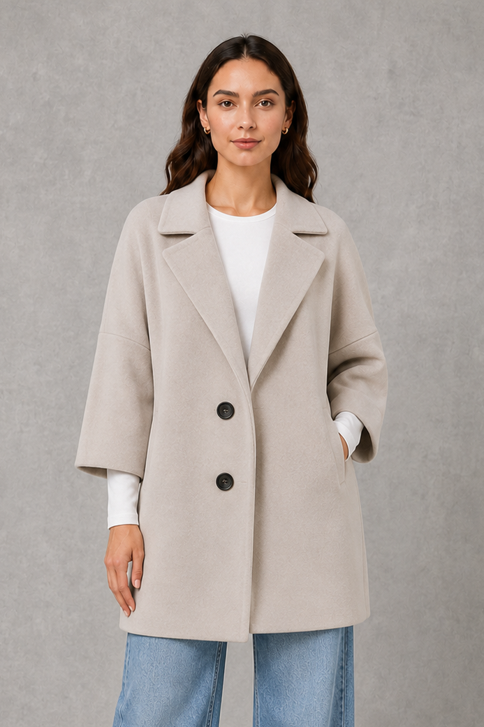 Women’s lightweight longline coat with a soft-touch finish and elegant streamlined silhouette for polished transitional layering.
