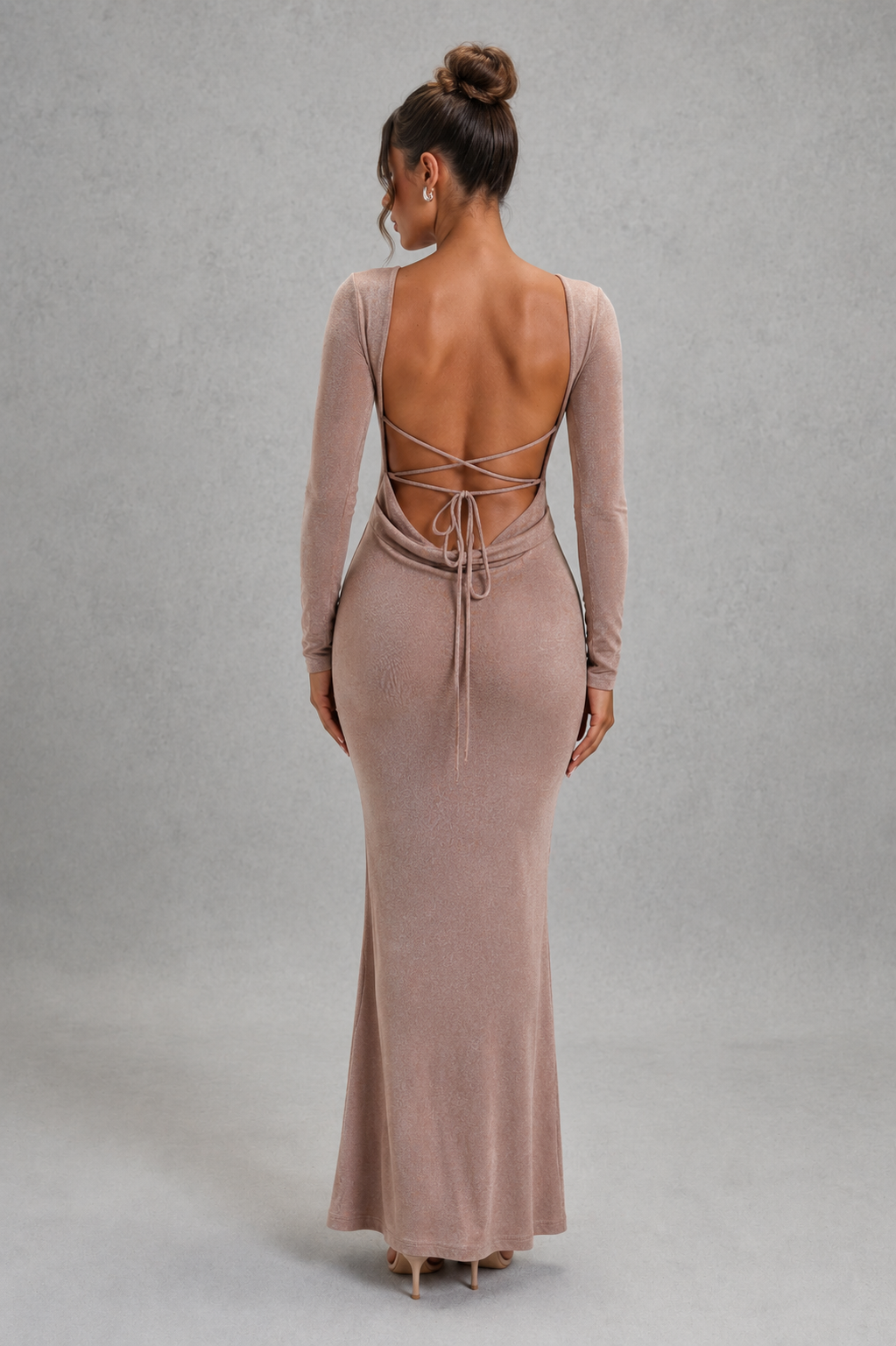 Women's long sleeve bodycon maxi dress in premium stretch fabric featuring a figure-hugging silhouette, dramatic low open back with adjustable tie detail, and elegant floor-length design for evening parties, formal events, and special occasions.