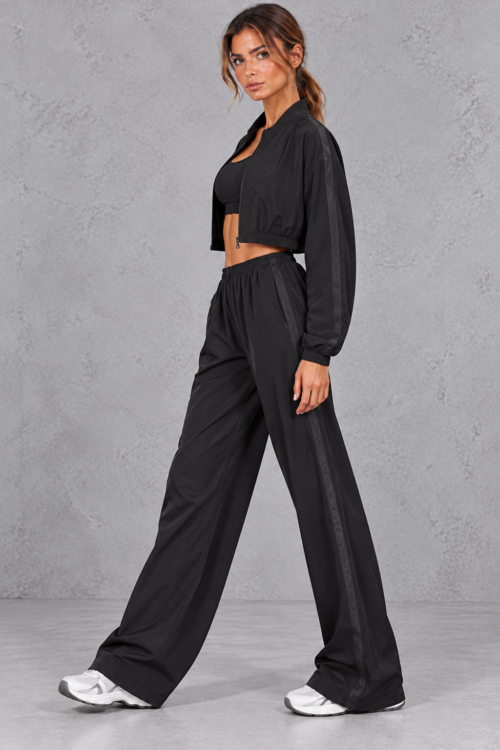 Back view of the cropped long sleeve activewear jacket and matching pants