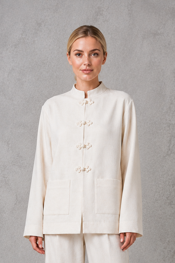 Women’s mandarin collar blazer with a sleek stand collar, streamlined front closure, structured woven fabric, and relaxed tailored silhouette.