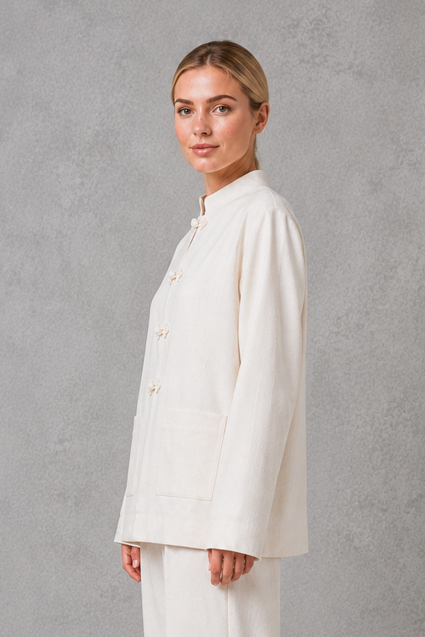 Women’s mandarin collar blazer with a sleek stand collar, streamlined front closure, structured woven fabric, and relaxed tailored silhouette.