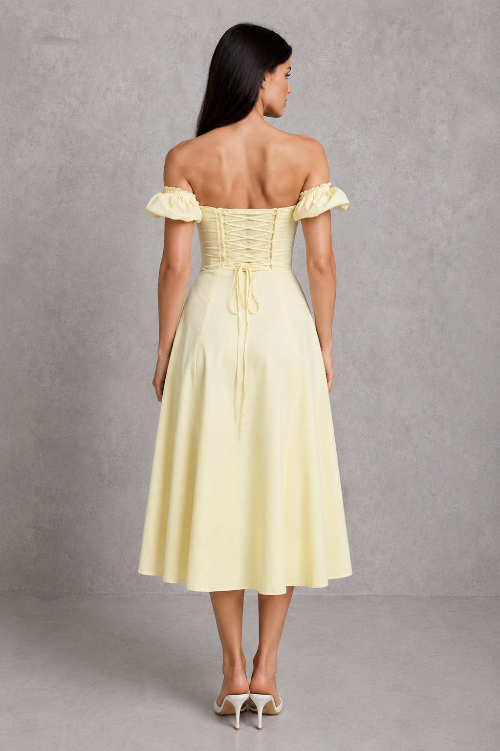 Elegant milkmaid midi dress in a premium cotton blend featuring a structured corset bodice with boning, underwired bust, elasticated puff sleeves, a flowing full skirt, and a thigh-high split. Designed with a shirred lace-up back for a flattering, feminine silhouette perfect for special occasions.