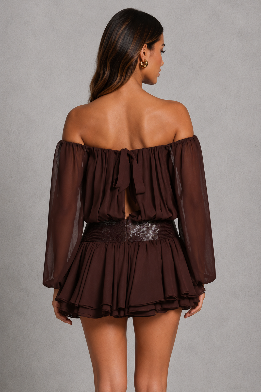 Women's Bardot chiffon playsuit with off-shoulder neckline, balloon sleeves, embellished waist, layered skirt overlay, and built-in shorts.