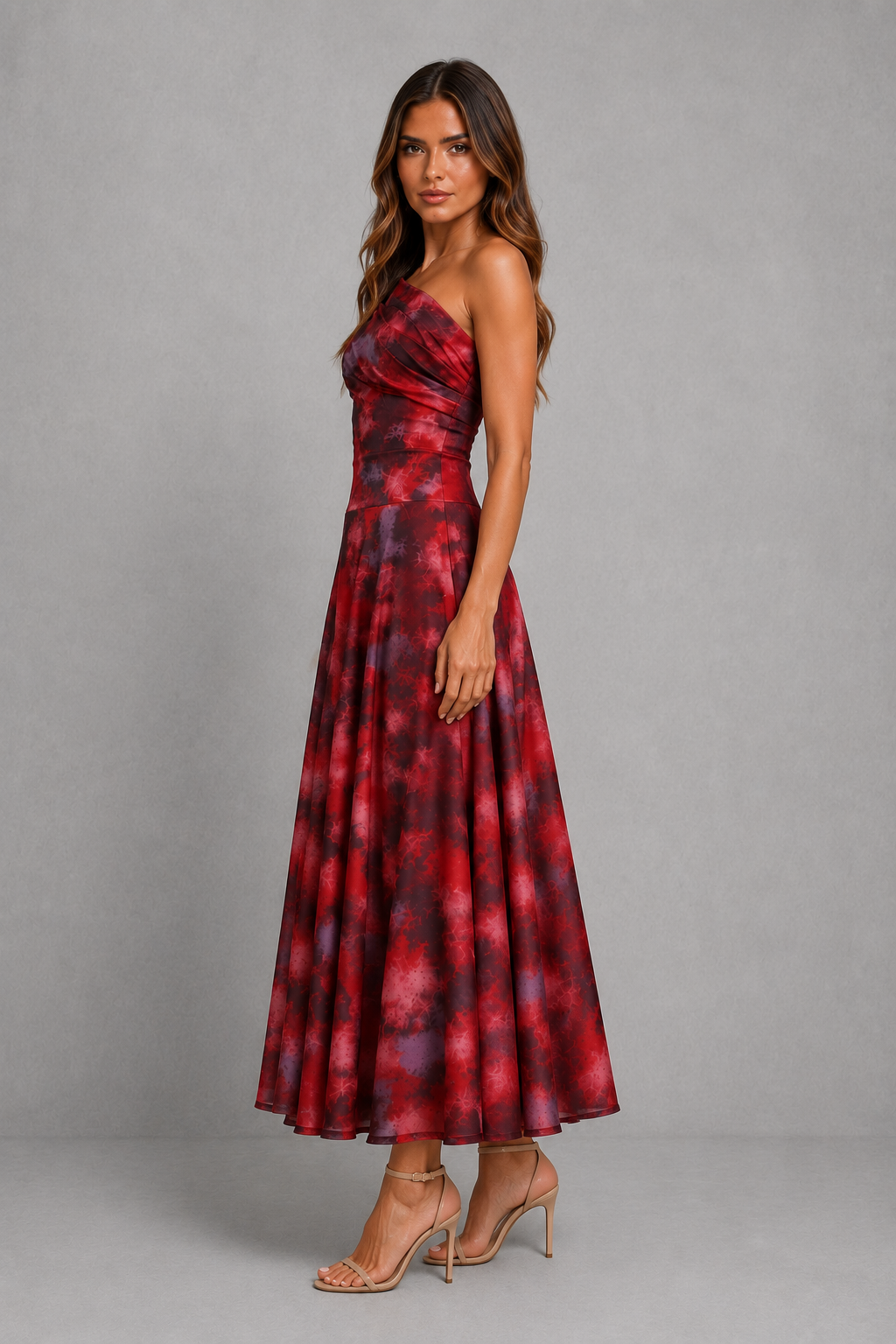 Women’s one-shoulder maxi dress with draped neckline and abstract burgundy and rose print, featuring a fitted waist and flowing full-length skirt.