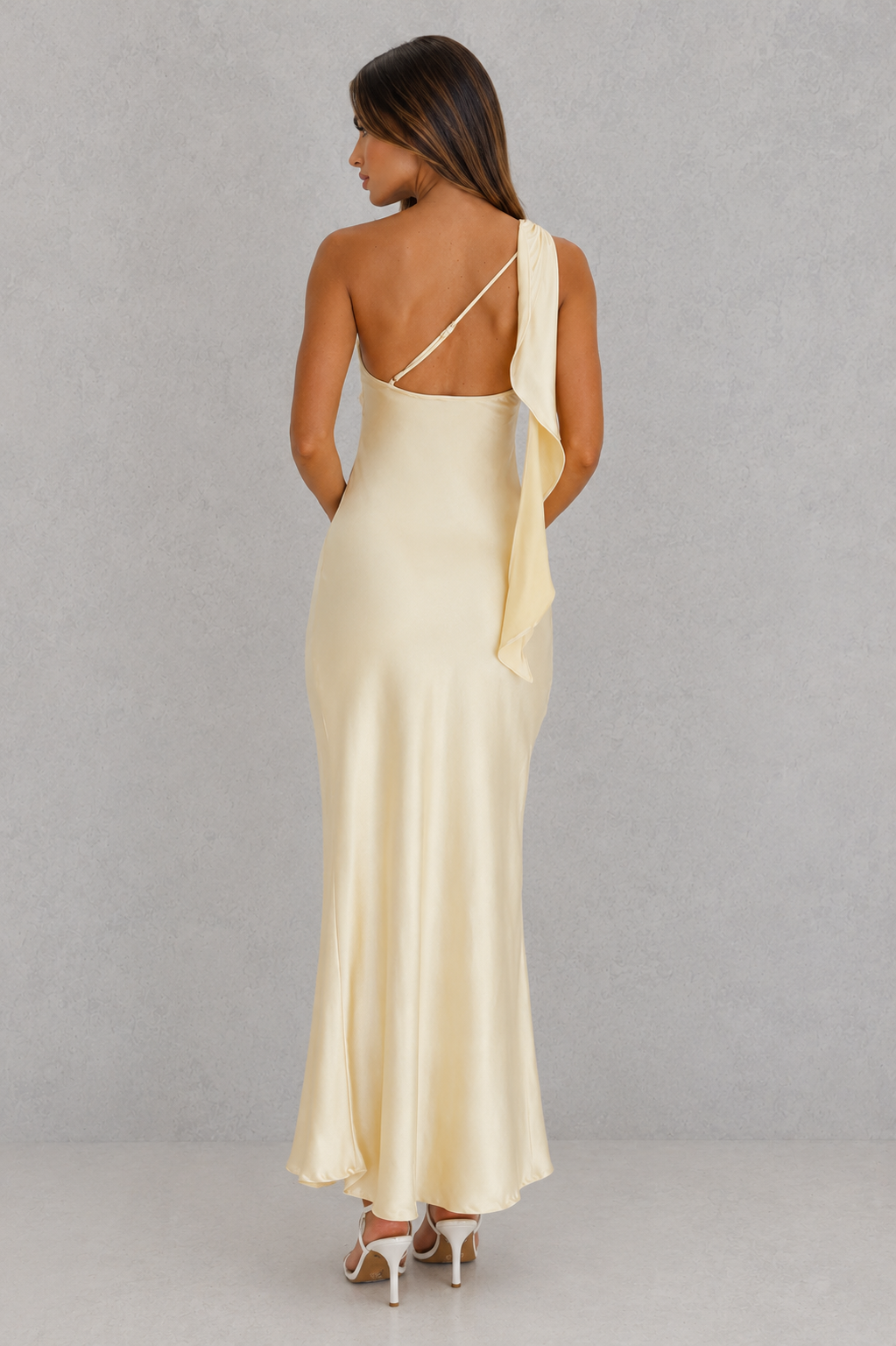 Women’s one-shoulder satin maxi dress with a flowing silhouette and statement ruffle detail along the back shoulder strap.