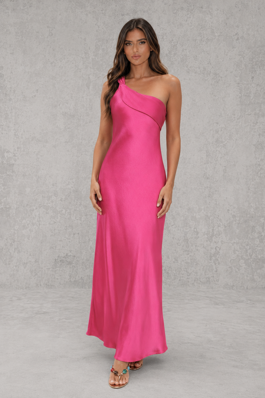 Women’s one-shoulder satin maxi dress with a flowing silhouette and statement ruffle detail along the back shoulder strap.