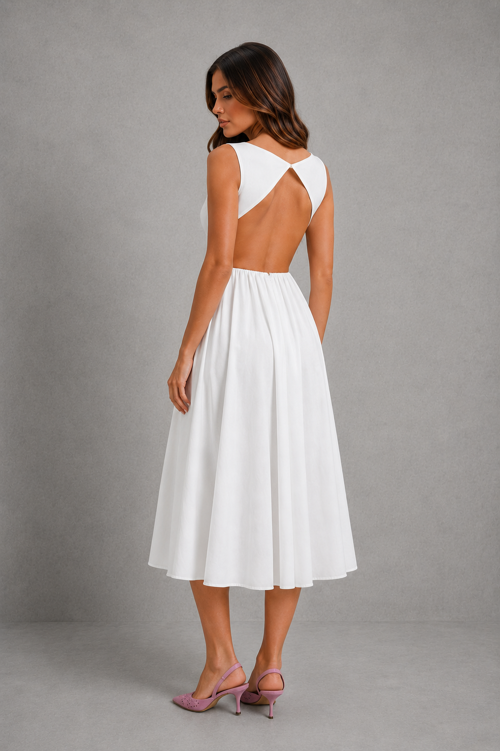 Women’s elegant open-back midi dress with sleeveless fitted bodice, round neckline and flowing A-line skirt for weddings and evening wear.