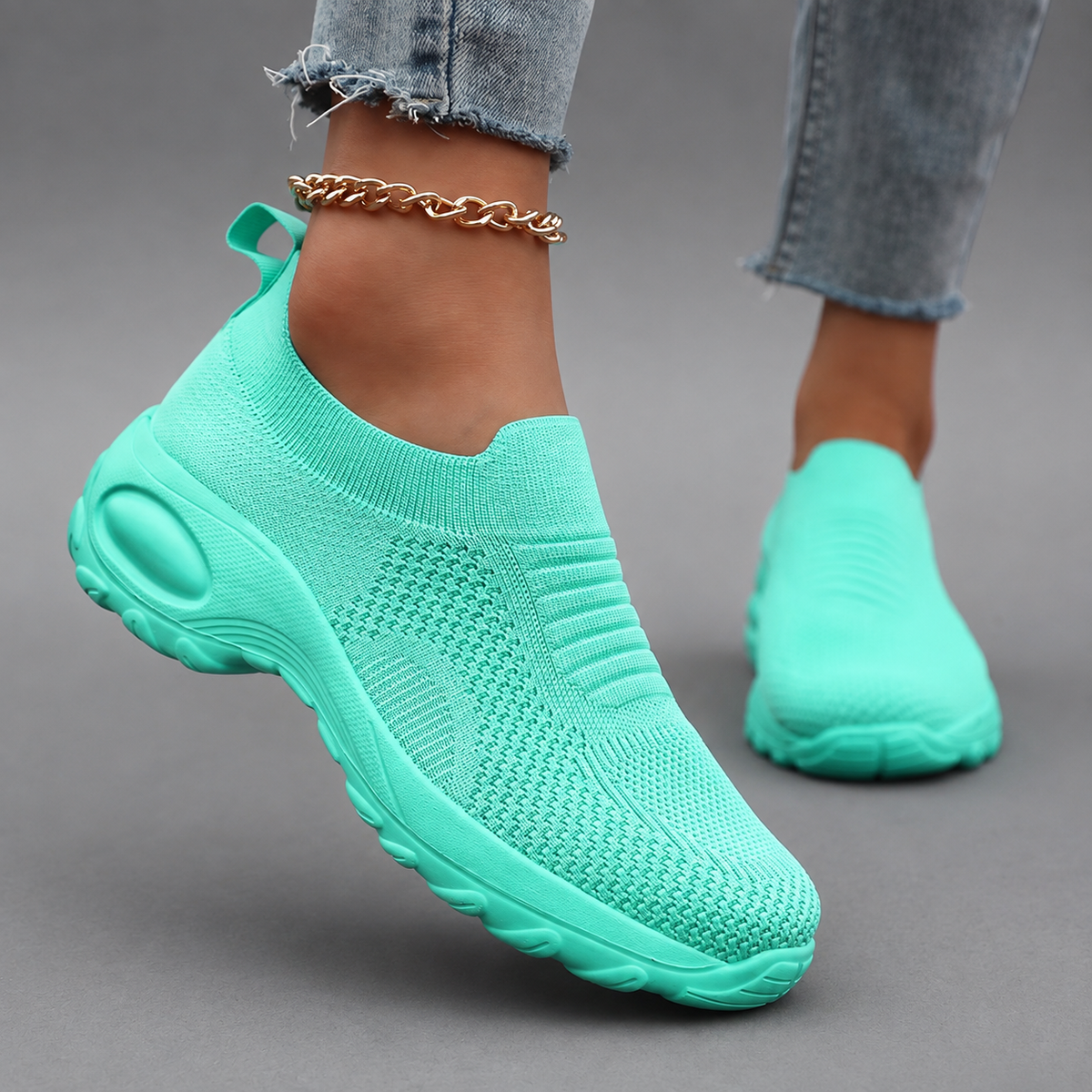Women’s orthopedic slip-on sneakers with a breathable stretch-knit upper, cushioned footbed and thick lightweight shock-absorbing sole.