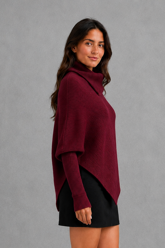 Women’s burgundy oversized batwing sweater with a cozy high neck, long relaxed sleeves, rib-knit texture and modern asymmetrical split hem.