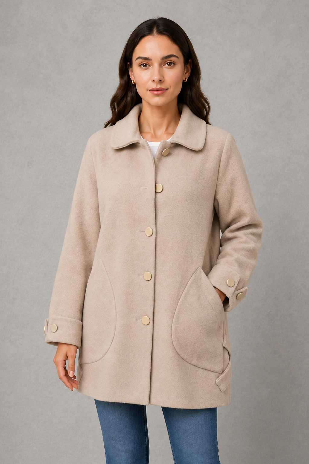 Women’s oversized mid-length winter coat with a relaxed silhouette, refined cuff detailing, spacious functional pockets, and a roomy fit for easy layering.