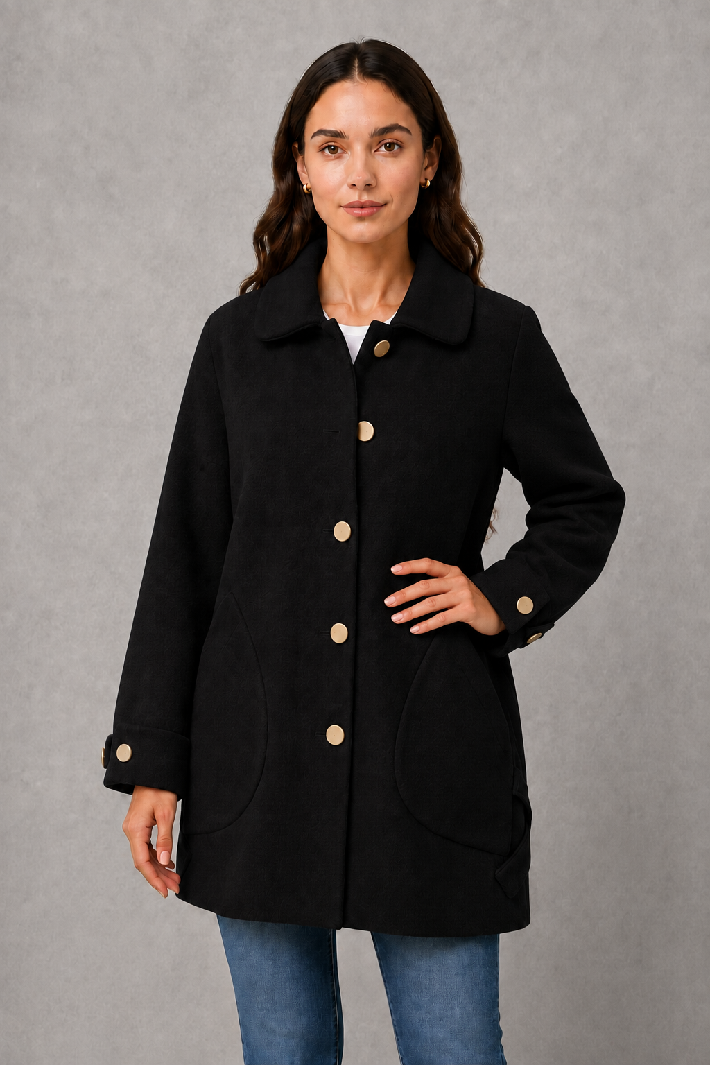 Women’s oversized mid-length winter coat with a relaxed silhouette, refined cuff detailing, spacious functional pockets, and a roomy fit for easy layering.