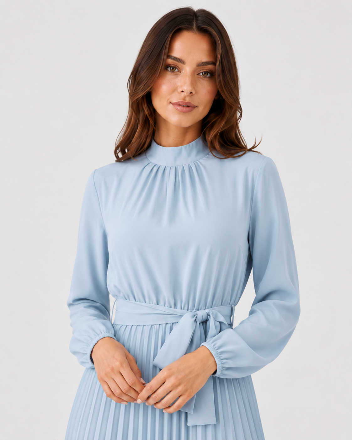 Women’s long-sleeve pleated midi dress featuring a high gathered neckline, fabric waist belt, and flowing pleated skirt. Designed with a fitted waist and relaxed silhouette for comfortable everyday wear.