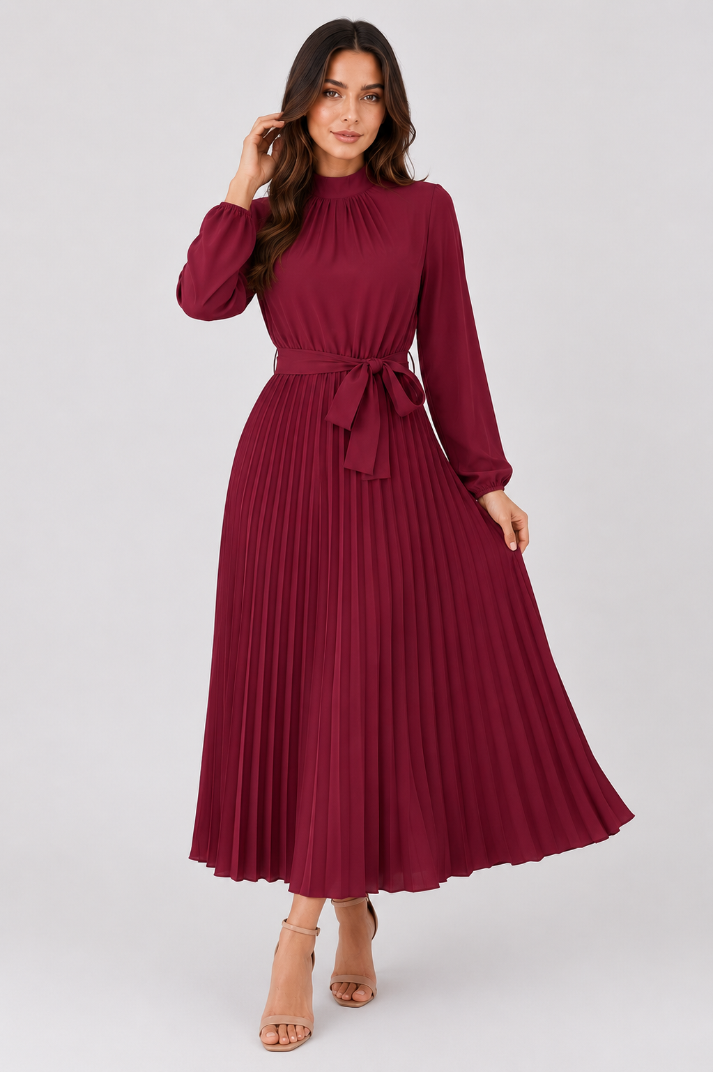 Women’s long-sleeve pleated midi dress featuring a high gathered neckline, fabric waist belt, and flowing pleated skirt. Designed with a fitted waist and relaxed silhouette for comfortable everyday wear.