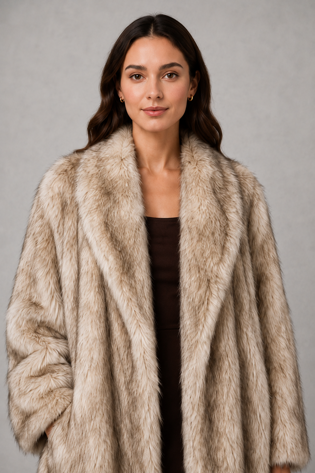 Women’s plush faux fur coat with a soft fluffy texture, voluminous statement silhouette, relaxed fit, and luxurious cold-weather finish.