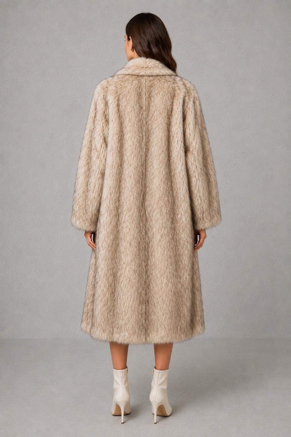 Women’s plush faux fur coat with a soft fluffy texture, voluminous statement silhouette, relaxed fit, and luxurious cold-weather finish.