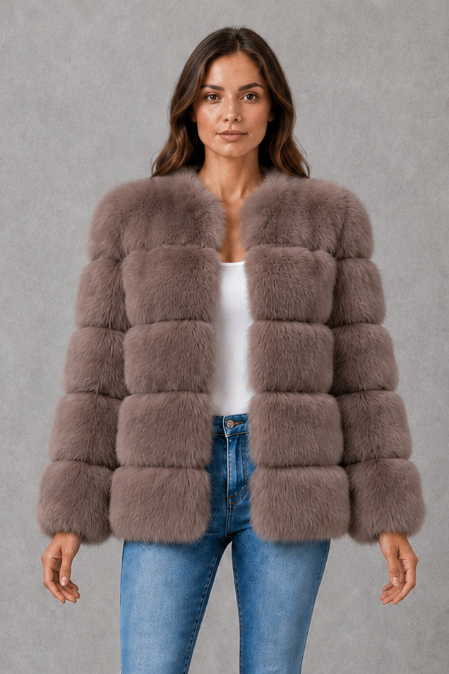 Women’s plush faux fur jacket with a luxuriously soft texture, elegant statement collar and relaxed silhouette for sophisticated cold-weather styling.