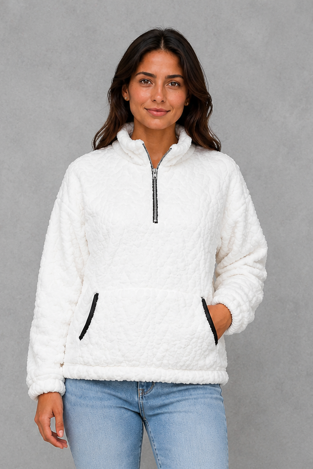 Women’s plush half-zip fleece pullover with a high stand neckline, soft fleece texture, two front pockets, long sleeves, and elasticized cuffs.