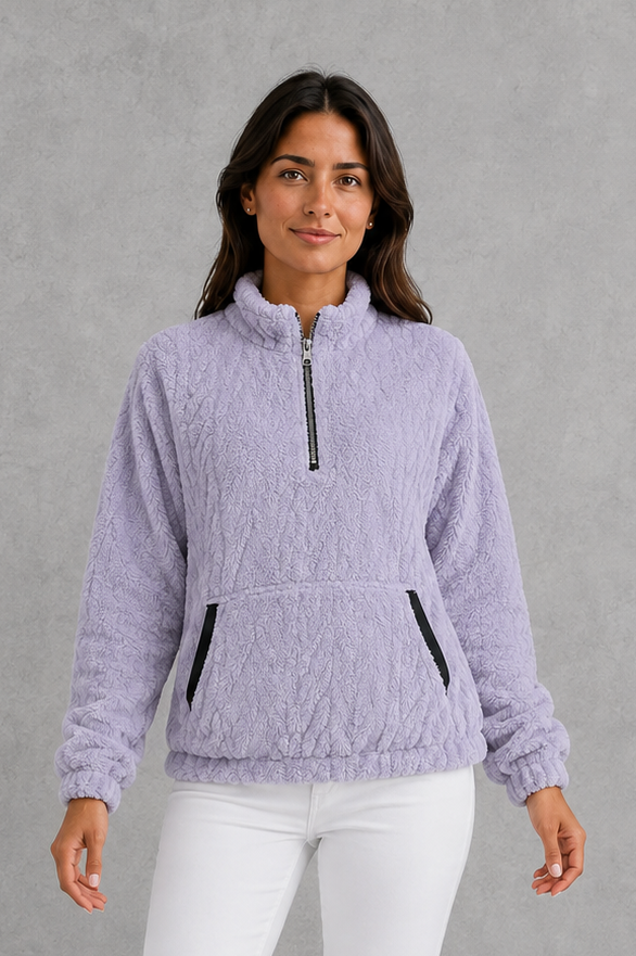 Women’s plush half-zip fleece pullover with a high stand neckline, soft fleece texture, two front pockets, long sleeves, and elasticized cuffs.