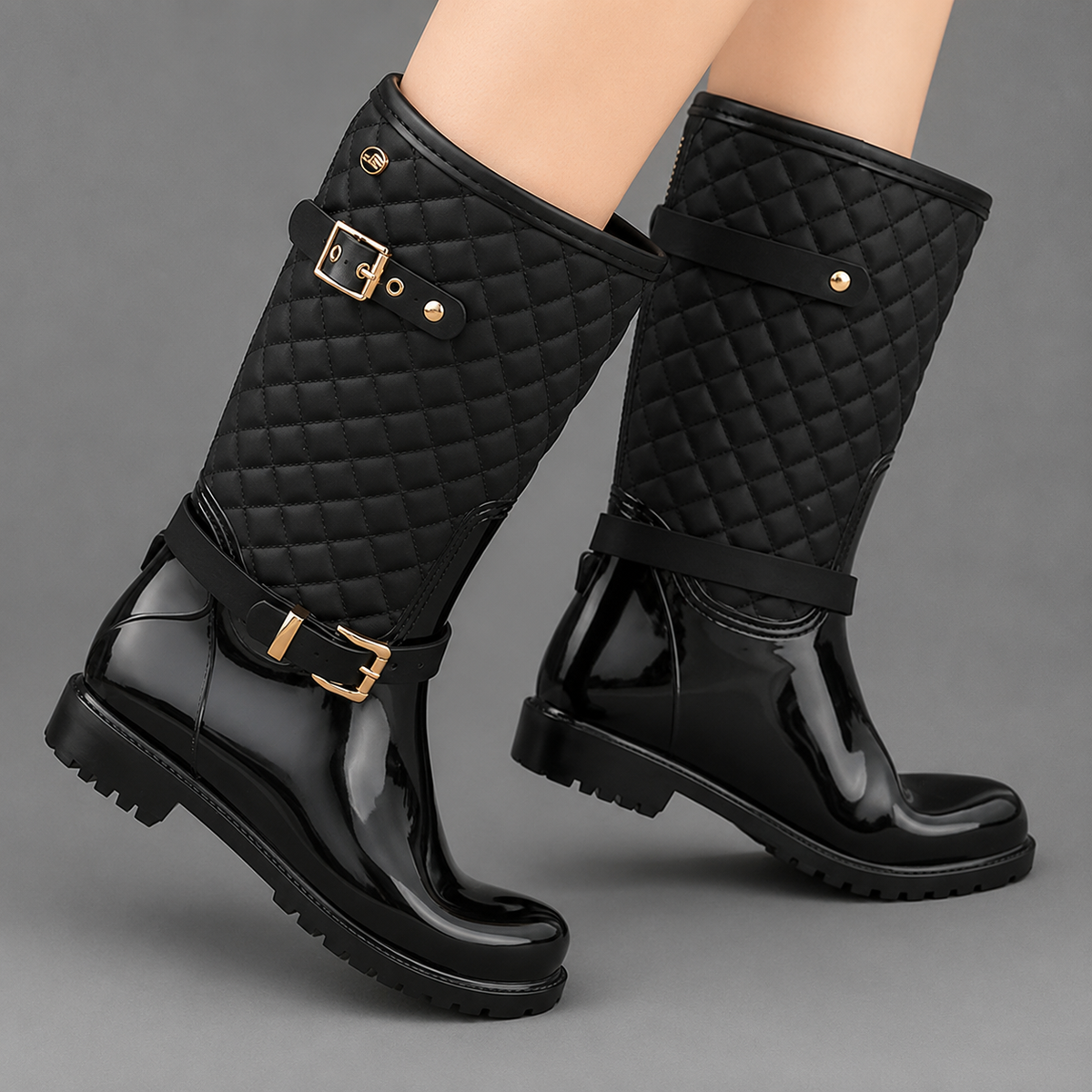 Women’s quilted plaid rain boots with waterproof PVC construction, decorative side buckle, mid-calf height, round toe, and non-slip rubber outsole.