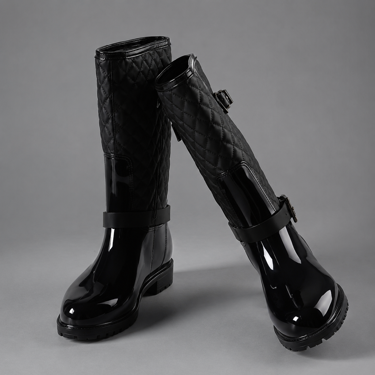 Women’s quilted plaid rain boots with waterproof PVC construction, decorative side buckle, mid-calf height, round toe, and non-slip rubber outsole.