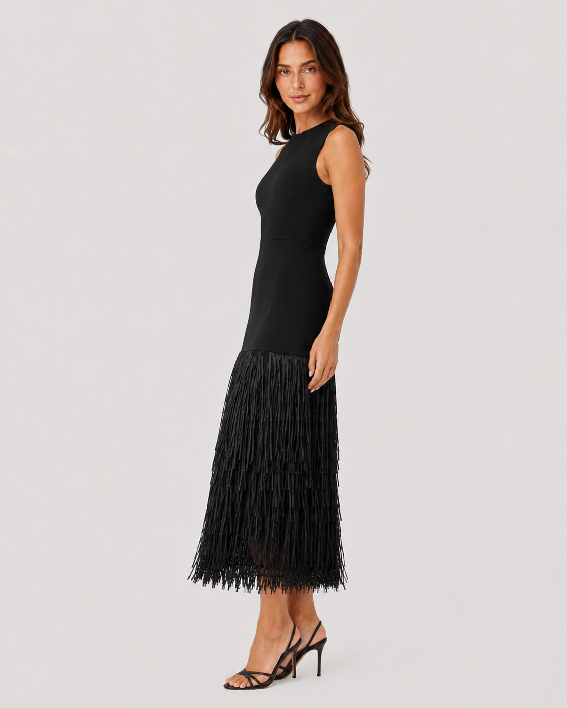 Women's raffia knit midi dress with textured weave, layered tassel detailing, and a flattering stretch-fit silhouette for warm-weather styling.