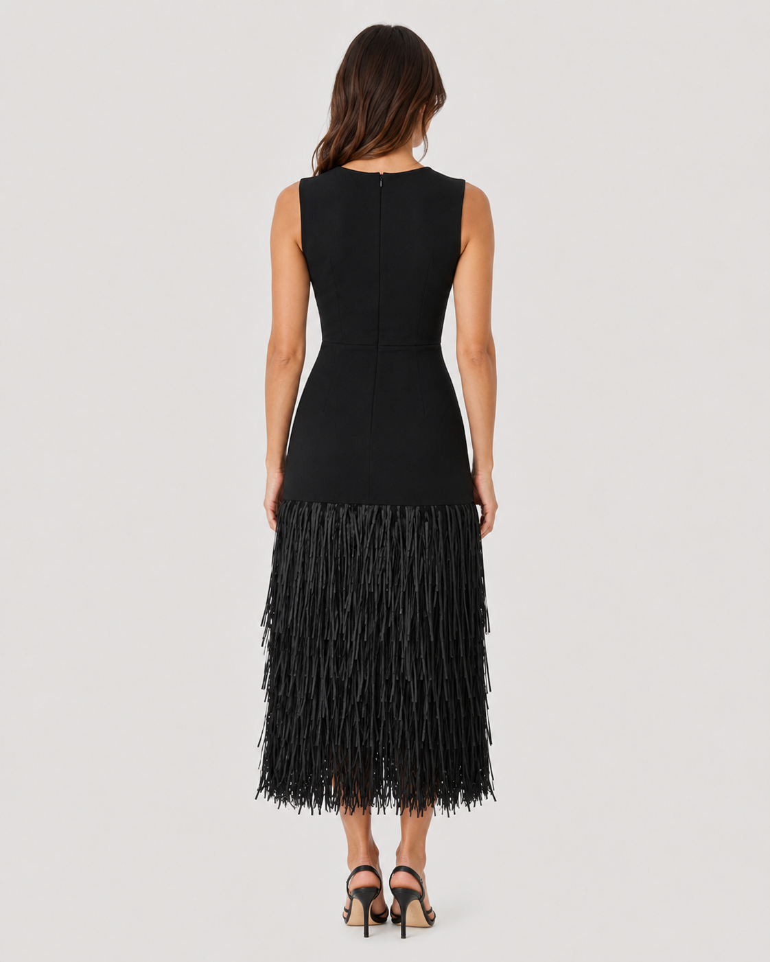Women's raffia knit midi dress with textured weave, layered tassel detailing, and a flattering stretch-fit silhouette for warm-weather styling.