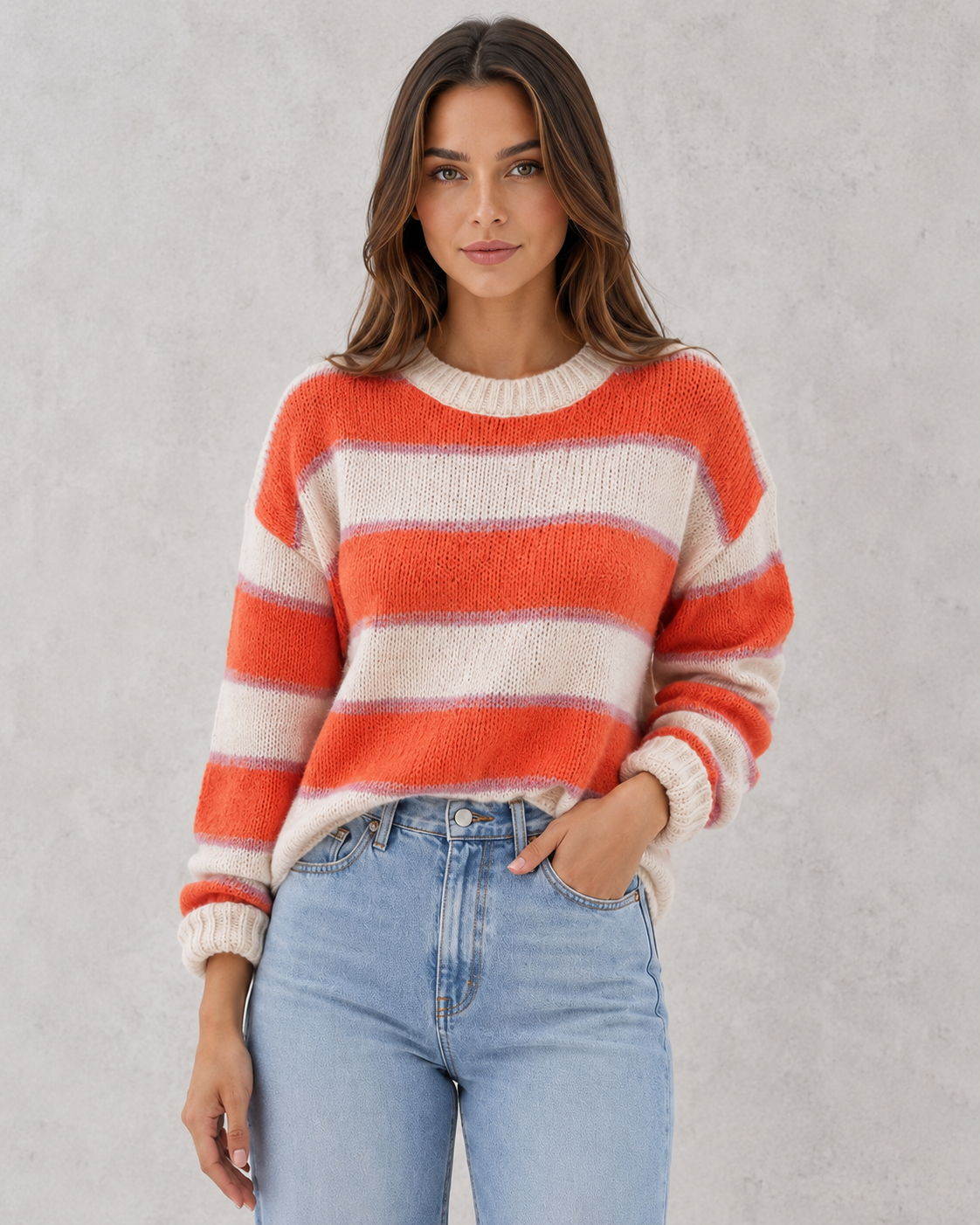 Woman wearing a regular fit blush and cream striped acrylic jumper with a soft knit texture and relaxed everyday styling.