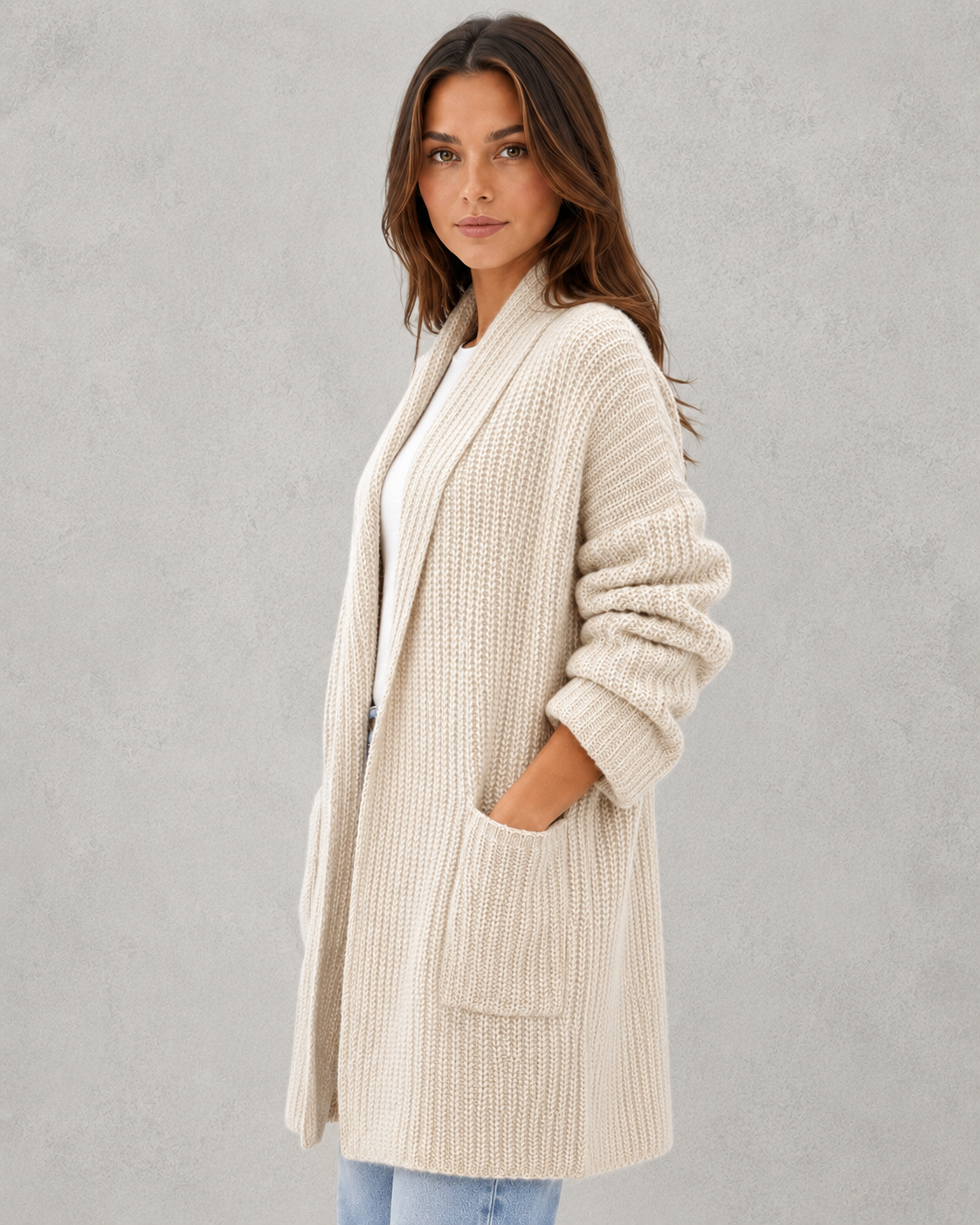Woman wearing a relaxed fit moonlit knit cardigan with a soft draped silhouette, lightweight texture, and elegant layering appeal for autumn styling.