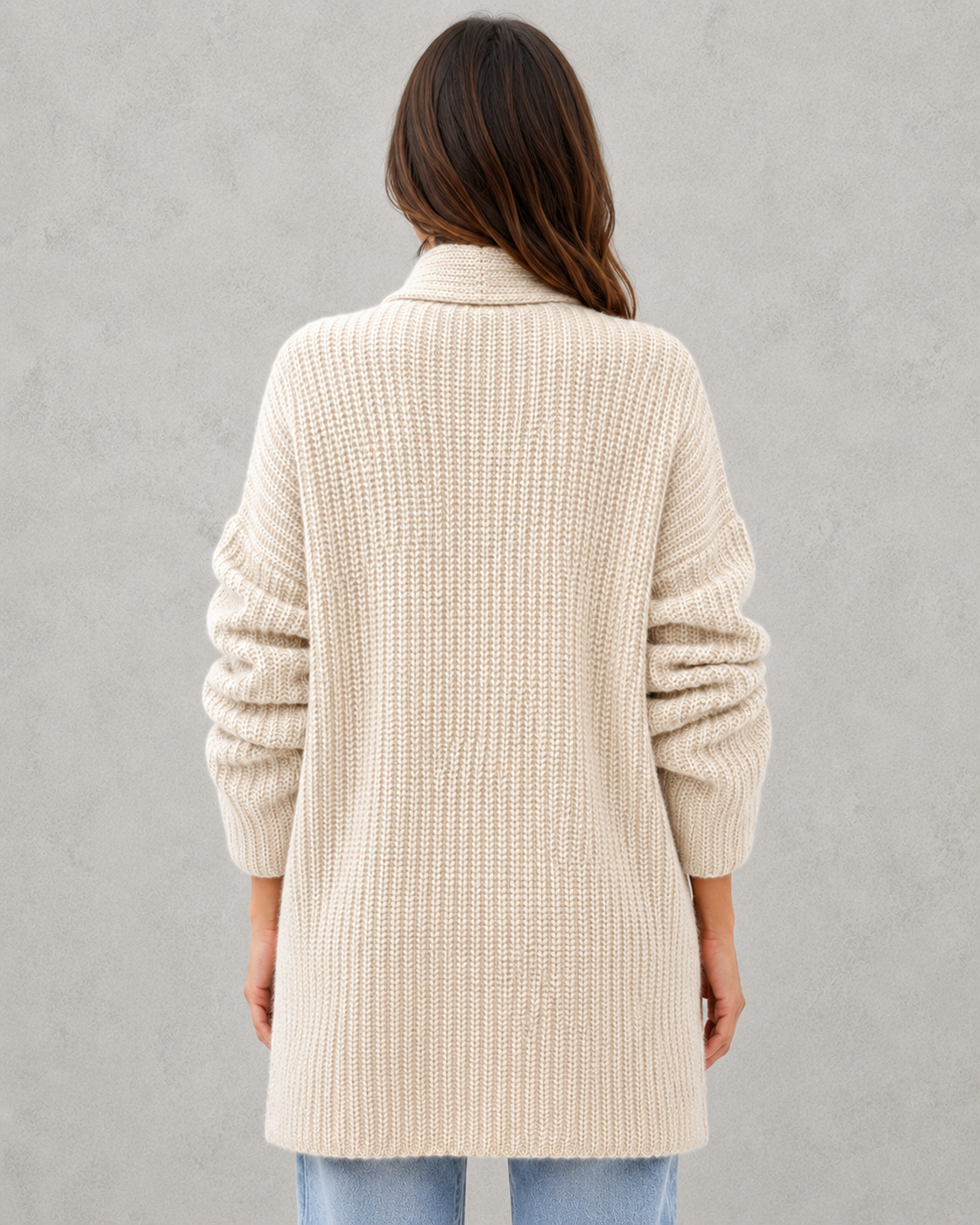 Woman wearing a relaxed fit moonlit knit cardigan with a soft draped silhouette, lightweight texture, and elegant layering appeal for autumn styling.