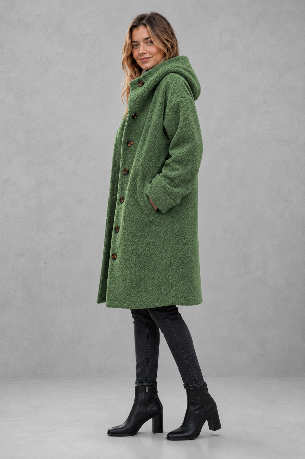 Women’s relaxed fit button coat with a classic overcoat silhouette, long sleeves, lightweight construction, and elegant button-front closure.