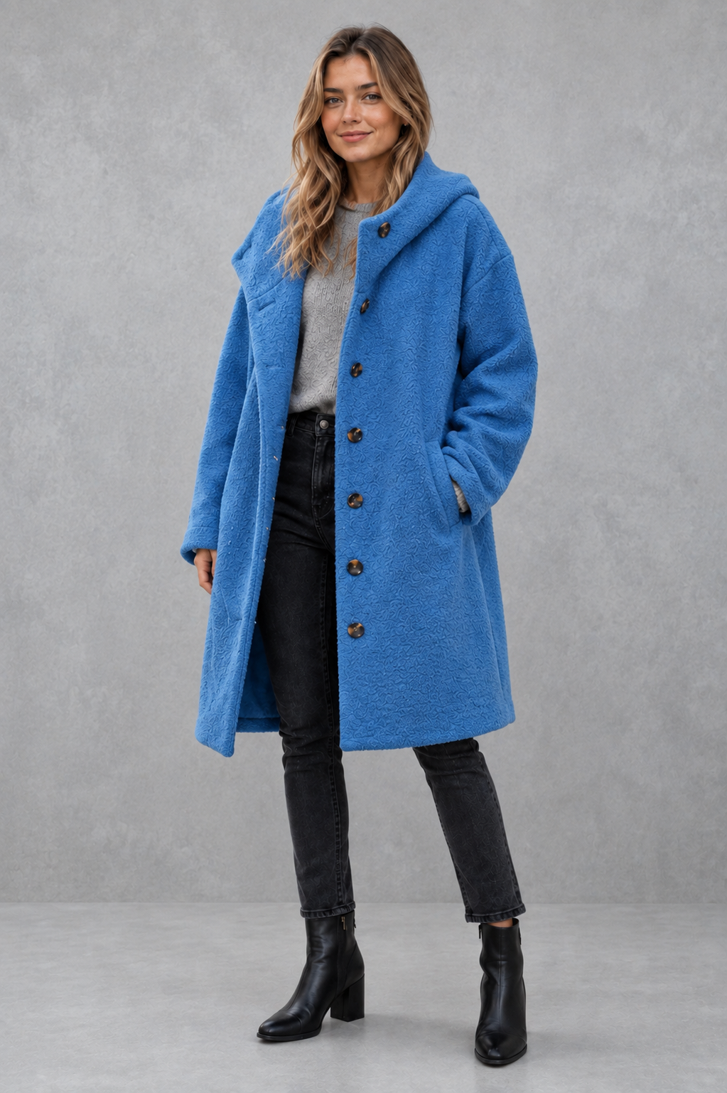 Women’s relaxed fit button coat with a classic overcoat silhouette, long sleeves, lightweight construction, and elegant button-front closure.
