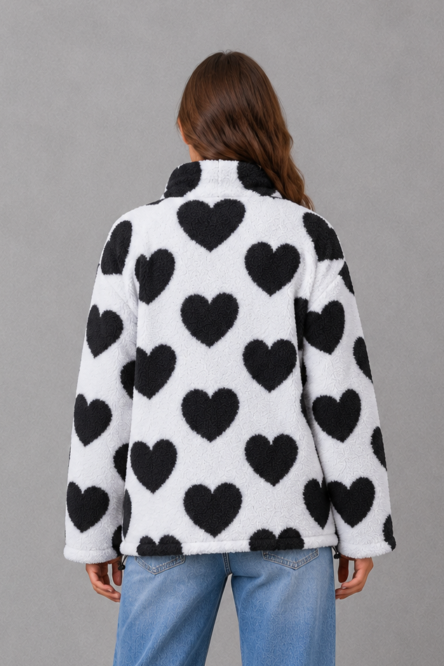 Women’s reversible heart print jacket with a lightweight soft-touch construction, feminine silhouette and versatile 2-in-1 design.