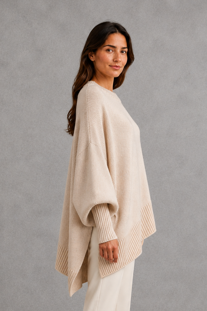 Women’s ribbed mock neck sweater with long sleeves, a relaxed softly draped silhouette and classic solid-color knitted design.
