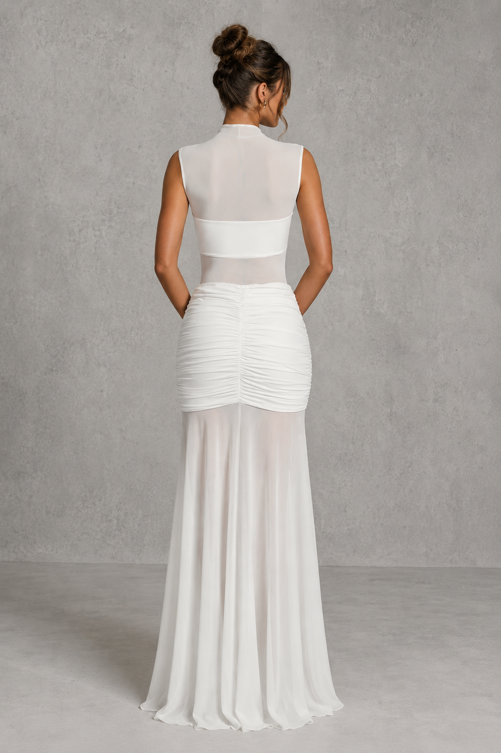 Women's ruched maxi skirt with a V-shaped waistband, slinky jersey upper, sheer mesh hem, and removable floral orchid brooch for evening and special occasion wear.