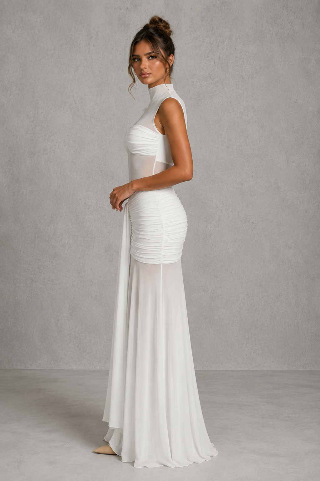 Women's ruched maxi skirt with a V-shaped waistband, slinky jersey upper, sheer mesh hem, and removable floral orchid brooch for evening and special occasion wear.