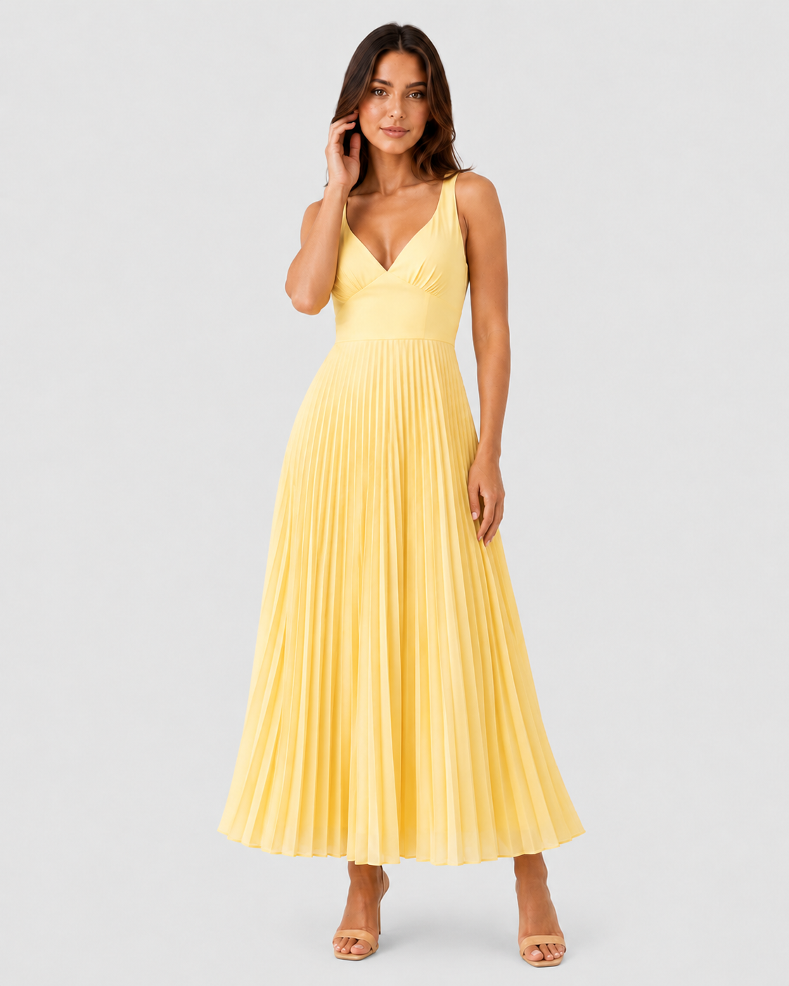 Woman wearing a satin-like maxi dress featuring a twist-front V-neck bodice, defined waist, and finely pleated full-length skirt. The fitted upper silhouette flows into a graceful, movement-friendly skirt for an elegant and sophisticated look.