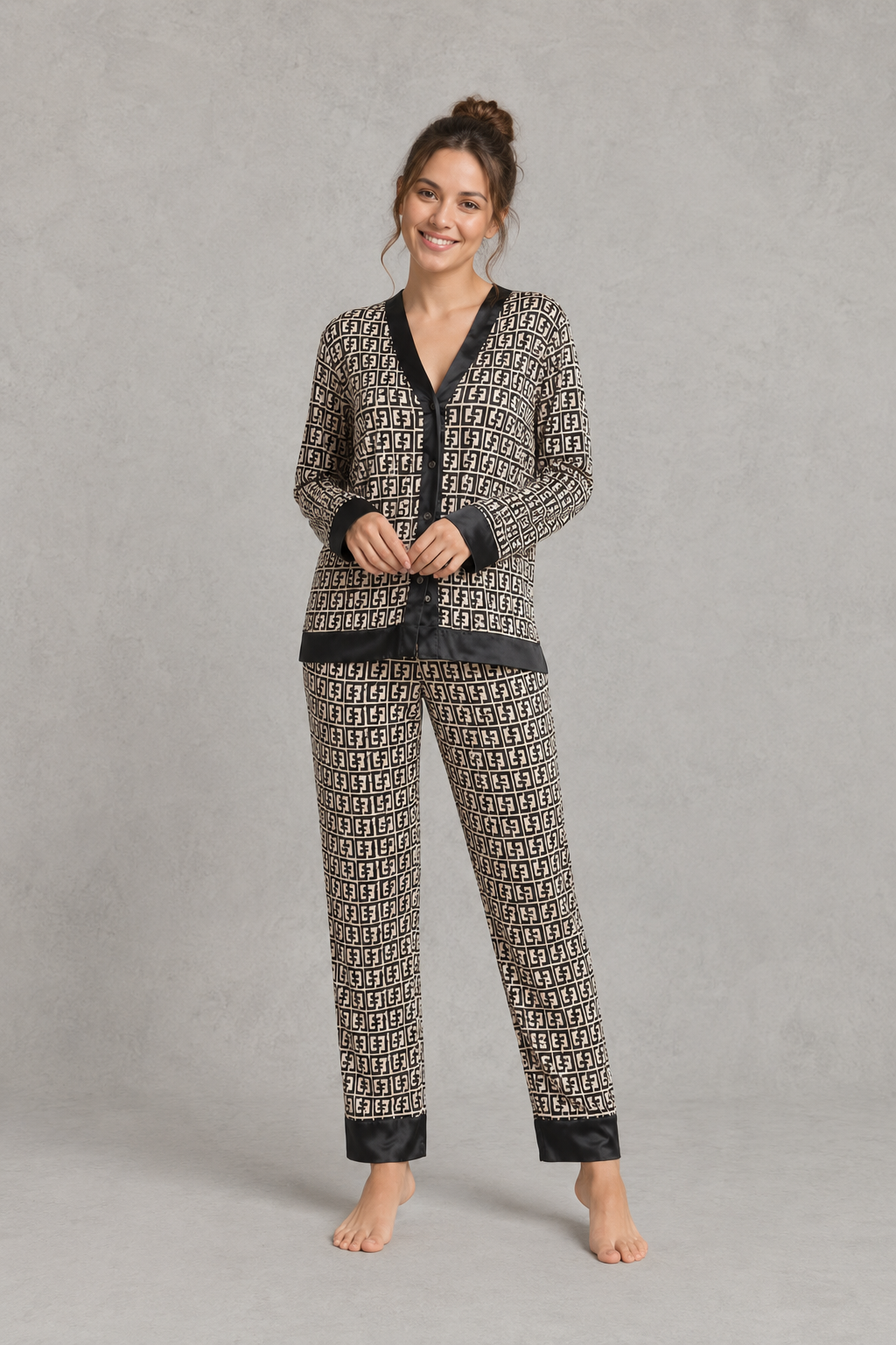Women’s satin 2-piece pajama set with a geometric print, long-sleeve button-up V-neck top, and matching full-length pajama pants.