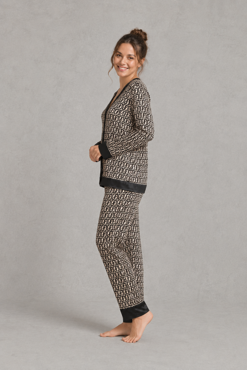 Women’s satin 2-piece pajama set with a geometric print, long-sleeve button-up V-neck top, and matching full-length pajama pants.
