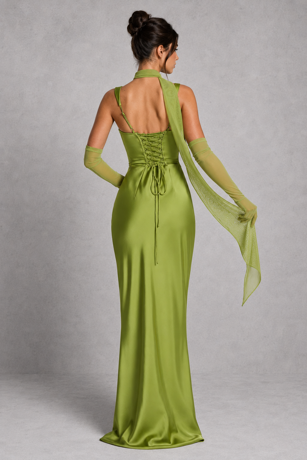 Women's satin maxi dress featuring a structured corset bodice, square neckline, asymmetric pleated detailing, adjustable shoulder straps, and a flowing full-length skirt with a lace-up back, designed for elegant evening events and formal occasions.