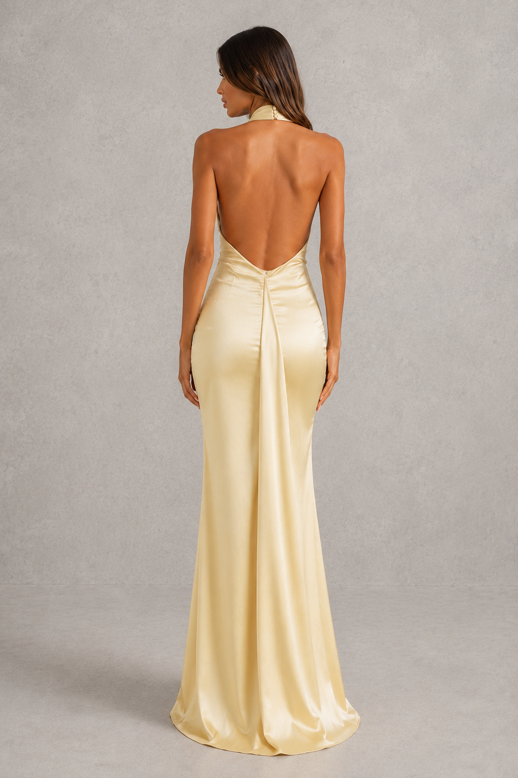 Women’s elegant satin maxi dress with cowl halter neckline, low scoop back, tie-back detail and flowing split skirt for formal evening wear.